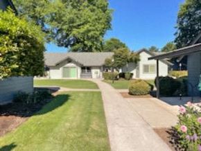 Junction City apartment for rent - A residential area with houses and greenery.