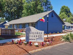 Junction City apartment for rent - A blue house with a sign that says Norsewain Village.
