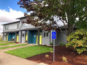 Eugene apartment for rent - a blue handicapped sign in front of a house