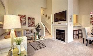 San Jose house for rent - a living room with a fireplace and a television