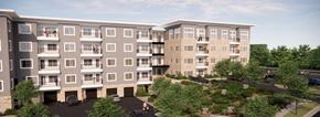 Blue Springs apartment for rent - an aerial view of an apartment building with trees and a parking lot