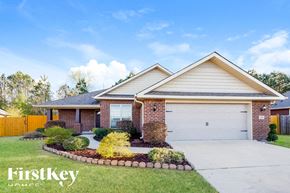 Montevallo house for rent - A house with a garage and a driveway in front of it.