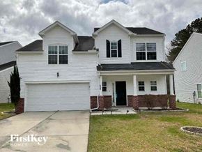 Goose Creek house for rent - a white house with a sidewalk in front of it