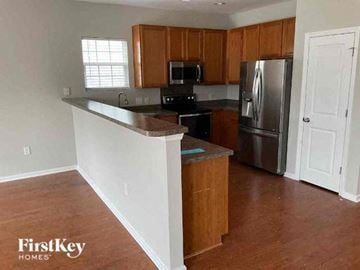Goose Creek house for rent - a kitchen with a counter top and a refrigerator