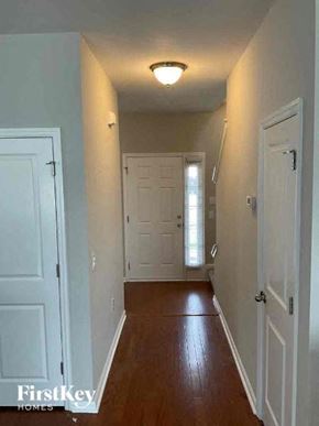 Goose Creek house for rent - a hallway with a white door and a light on the ceiling