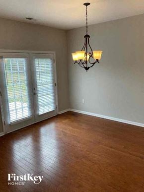 Goose Creek house for rent - a living room with a wood floor and a chandelier