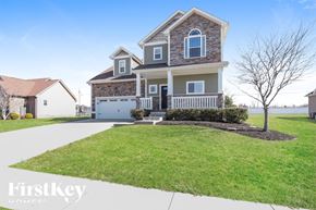 Clarksville house for rent - A large house with a garage is shown in the image.