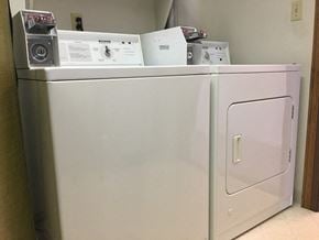 Durand apartment for rent - a white refrigerator with some appliances on top of it