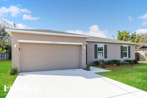 Port St. Lucie house for rent - A two-car garage is attached to a house.