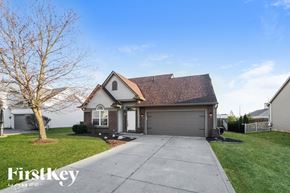 Avon house for rent - A house with a brown roof and a garage door is shown.