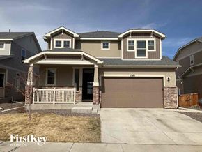 Commerce City house for rent - a house with a garage and a driveway