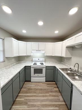 Lafayette apartment for rent - an empty kitchen with white cabinets and white counter tops and a stainless steel sink