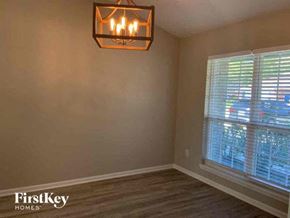Middleburg house for rent - a living room with a large window and a chandelier