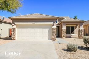 San Tan Valley house for rent - a single story home with a white garage door