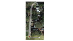 Egan apartment for rent - an aerial view of a road with cars and trees