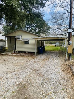 Egan apartment for rent - a small house with a dirt road in front of it