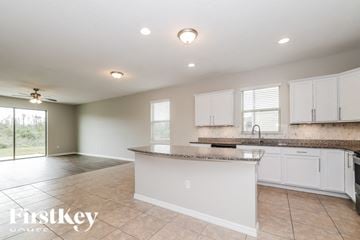 Saint Cloud house for rent - A kitchen with a counter and cabinets is shown in this image.