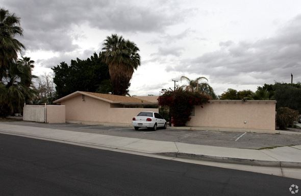 Palm Desert apartment for rent - a car parked in front of a house with palm trees