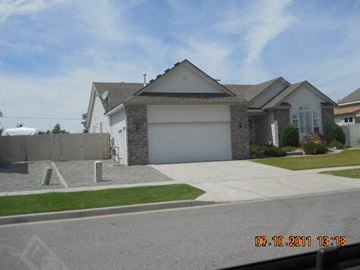 Hayden house for rent - a house with a white garage door on a driveway