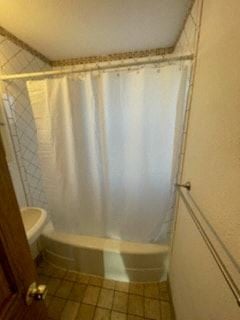Trinidad house for rent - a bathroom with a white shower curtain and a toilet
