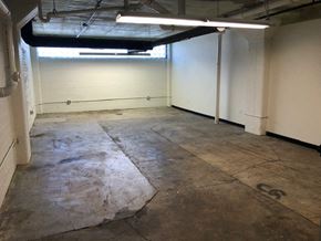 Cleveland apartment for rent - a large room with a concrete floor and white walls