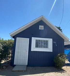 Colton apartment for rent - a small blue house with a white window