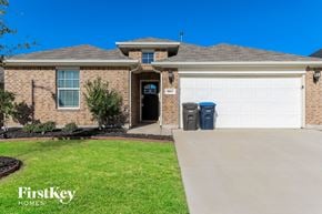 Fort Worth house for rent - a house with a driveway and a garage door