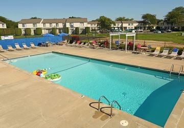 Saginaw apartment for rent - a swimming pool is shown at an apartment complex with a pool
