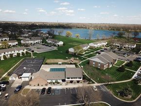 Saginaw apartment for rent - an aerial view of a neighborhood of houses with a lake in the background