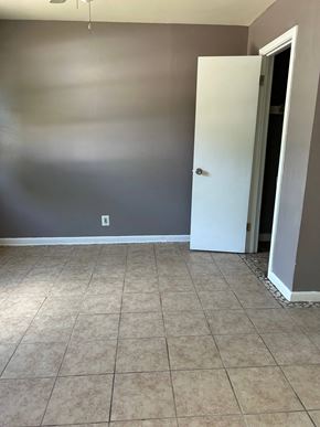 Killeen apartment for rent - an empty room with a tiled floor and a door