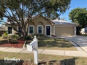 Jacksonville house for rent - a house with a mailbox and a tree in front of it