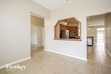 Middleburg house for rent - A spacious room with a mirror reflecting a kitchen.