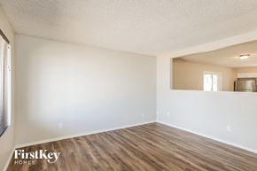 Glendale house for rent - the spacious living room with wood flooring and white walls