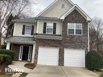 Acworth house for rent - a brick house with two garage doors
