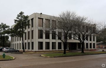 Houston apartment for rent - an office building on the corner of a city street