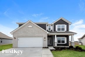 Greenfield house for rent - A two-story house with a garage is for sale.