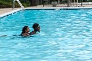 Herndon apartment for rent - a man and a woman in a swimming pool