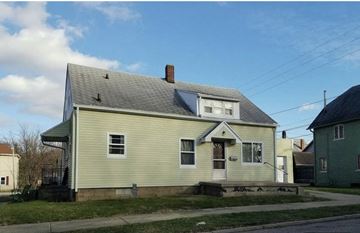 Logansport apartment for rent - a white house on the side of a street