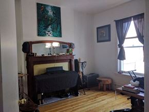 Ottawa apartment for rent - a bedroom with a bed and a mirror in it