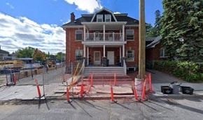 Ottawa apartment for rent - a red brick house with orange cones in front of it