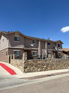 El Paso apartment for rent - a large building with a stone wall in front of it