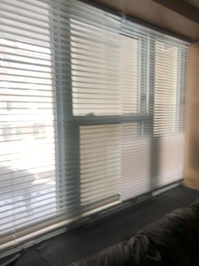 Waterloo apartment for rent - A window with white blinds in a room.