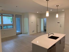 Winnipeg apartment for rent - an empty kitchen and living room in a new home