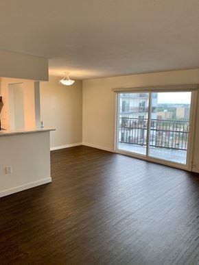 Winnipeg apartment for rent - an empty living room with wood flooring and a balcony