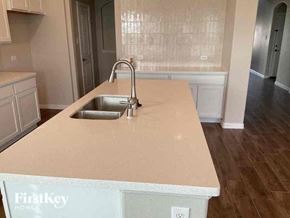 Haslet house for rent - a kitchen with a sink and a counter top