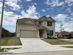 Haslet house for rent - a house with a driveway and a garage door