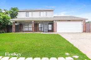 Fort Worth house for rent - A house with a garage and a driveway in front of it.
