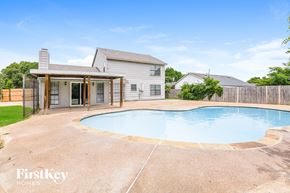 Fort Worth house for rent - A house with a pool in the backyard.