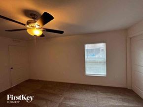 North Port house for rent - a living room with a ceiling fan and a window