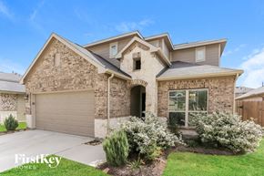 Rosharon house for rent - A house with a garage and a driveway.